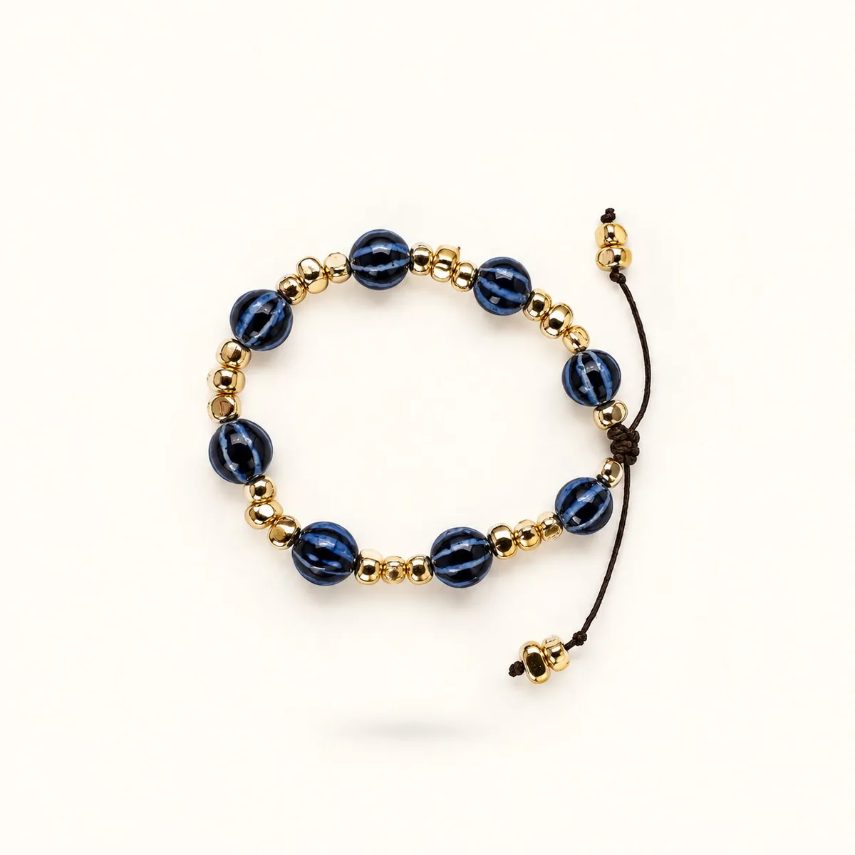Indigo — Cerámica esmaltada y acentos de oro, joyería artesanal hecha a mano